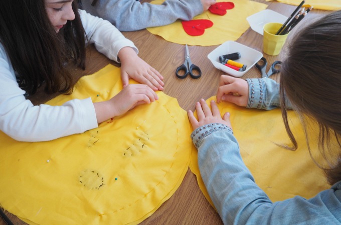 Girls hand sewing