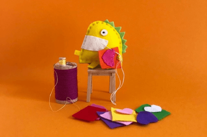 soft toy sitting on a chair sewing
