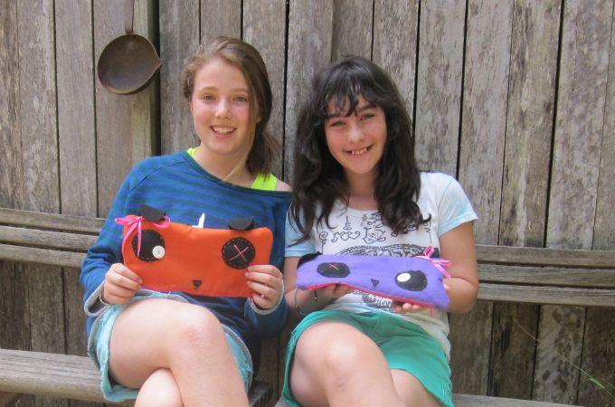 Two girls with a hand sewn felt pencil case