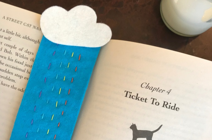 A colorful felt rainy day rainbow bookmark stitched by kids, ideal for back-to-school reading.